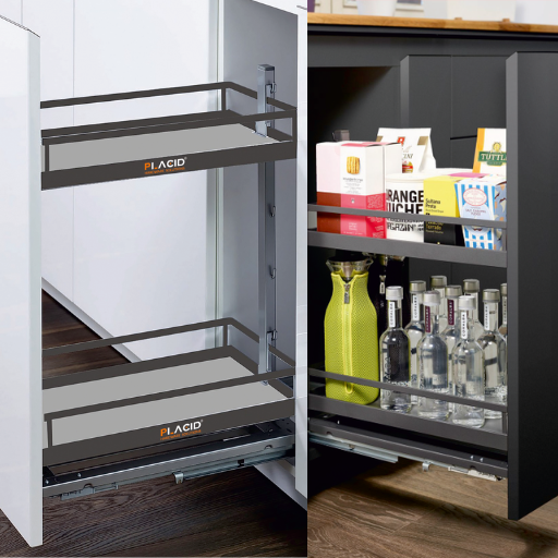 Kitchen pull-out drawer with chrome basket holding black bottles, white cabinetry, and gray floor